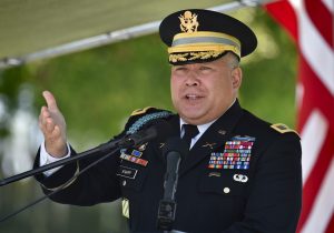 Member of United States Military speaking into microphone on Memorial Day