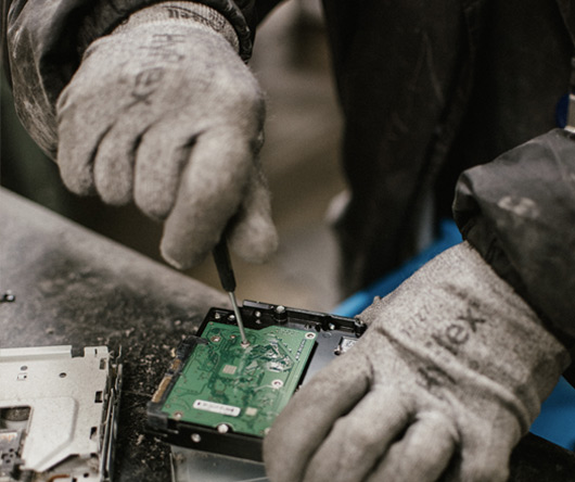 Hands working on circuitboard.