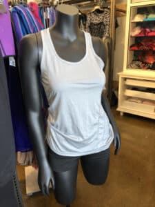 Mannequin with grey vest displayed inside Goodwill Store & Donation Center