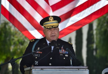 Member of United States Military speaking into microphone