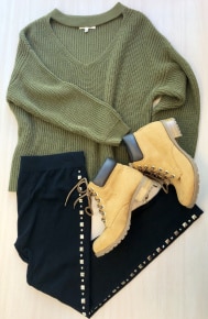 Over sized olive chunky sweater with leggings and boots.