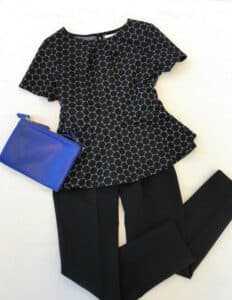 Blue polka dot blouse, pants, and purse