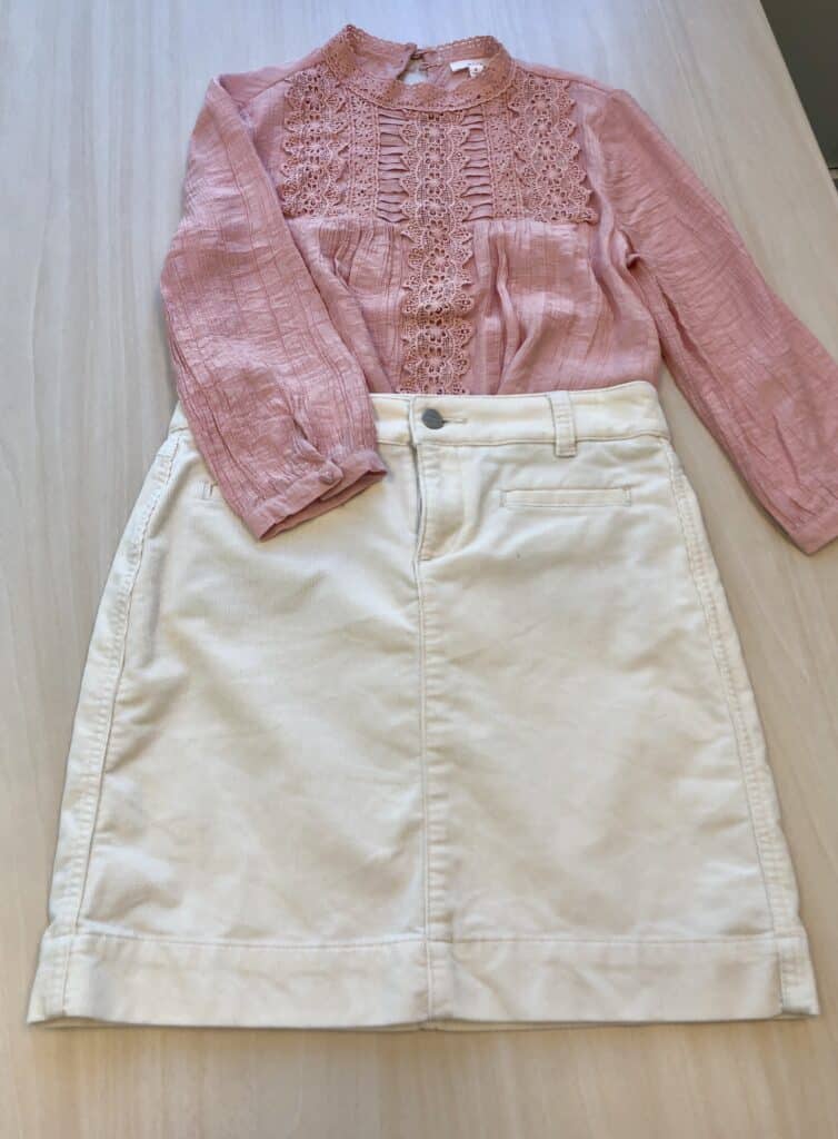Sweet high-neck blouse paired with a classic corduroy skirt.