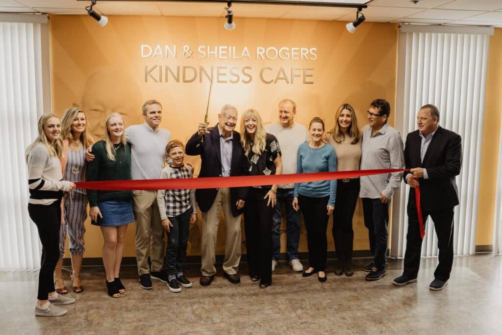 People pose at Dan and Sheila Rogers Kindness Cafe