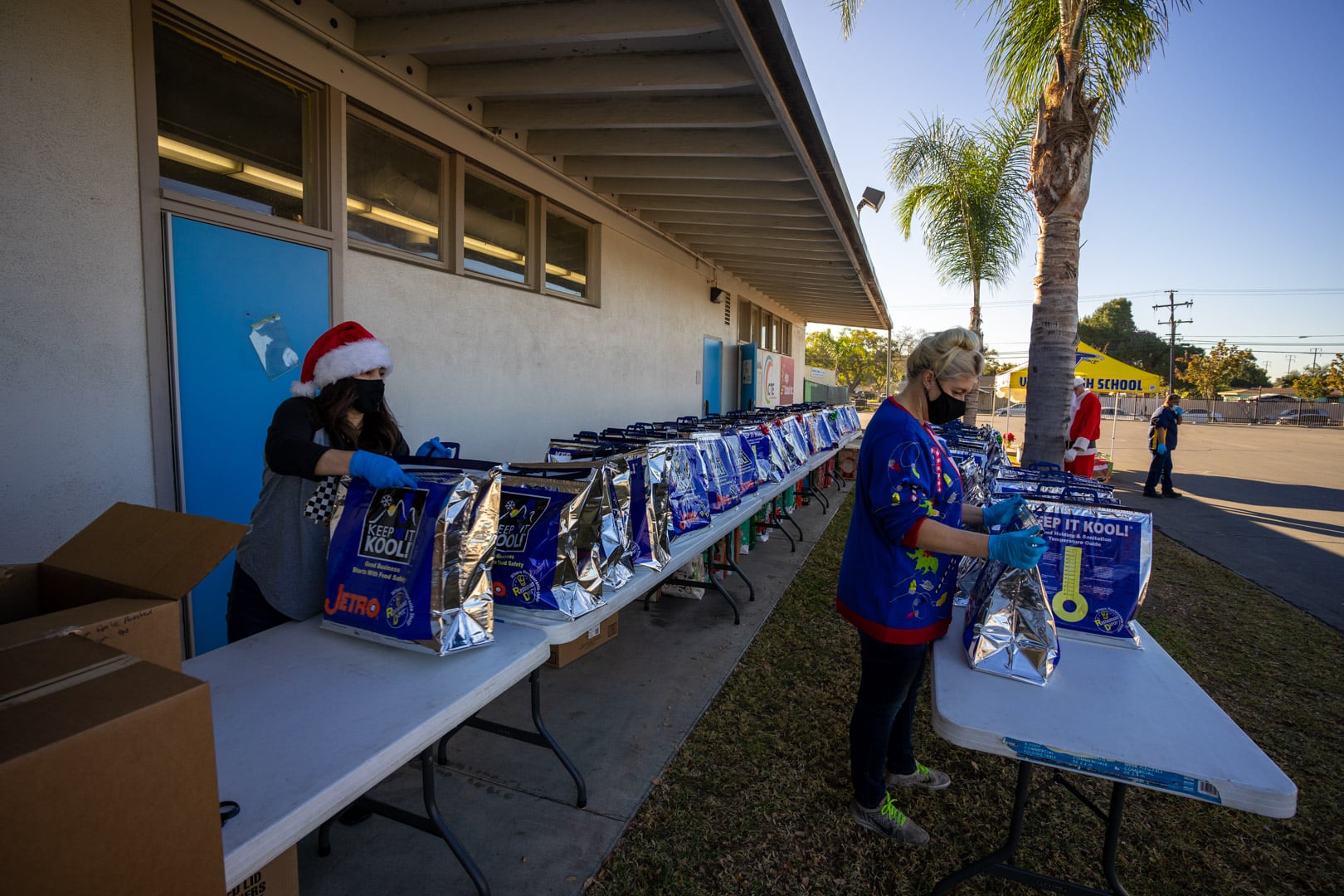 Ladies arranging holiday meal baskets.