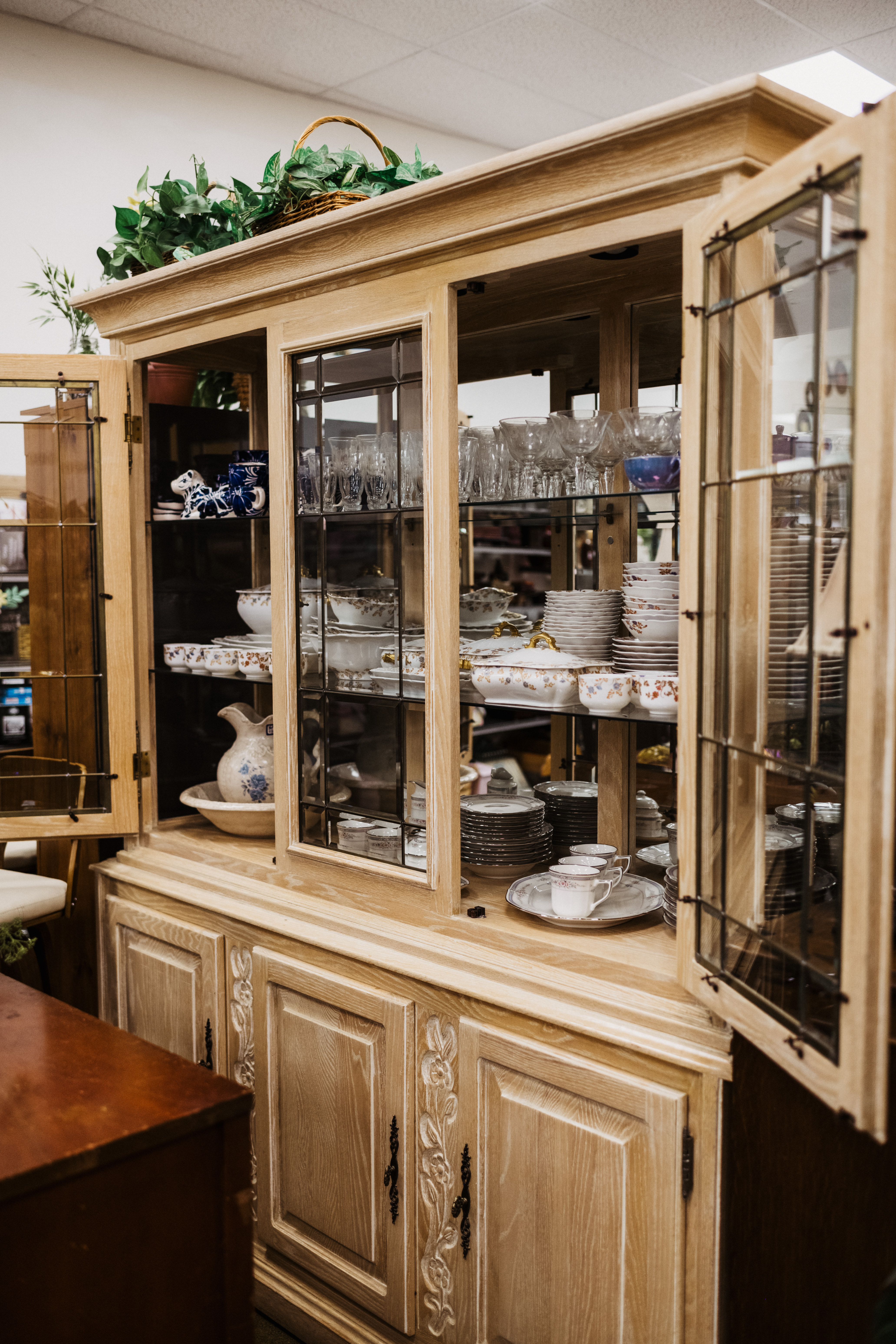 crockery shelf with serving plates and glassware