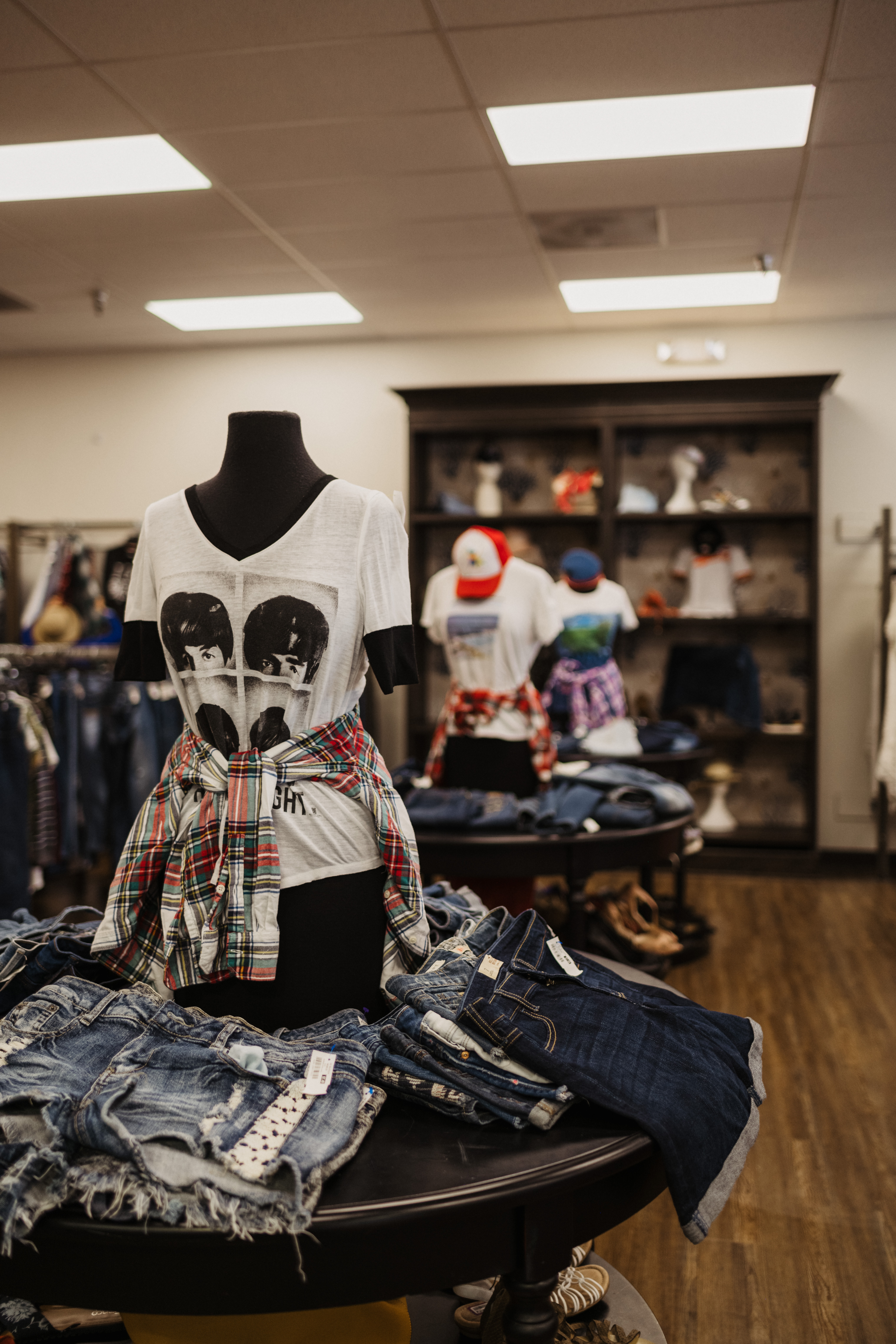 classic white T-shirt dis[played on mannequin and staple denim shorts