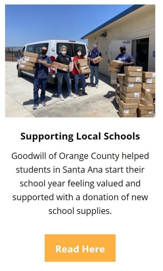 People carrying donation boxes of new school supplies