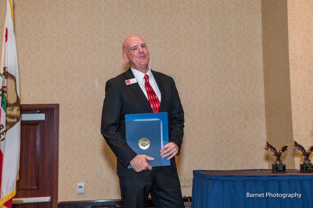 Eric Bisaillon with Chamber Ambassador of the Year Award at Santa Ana Chambers 2019