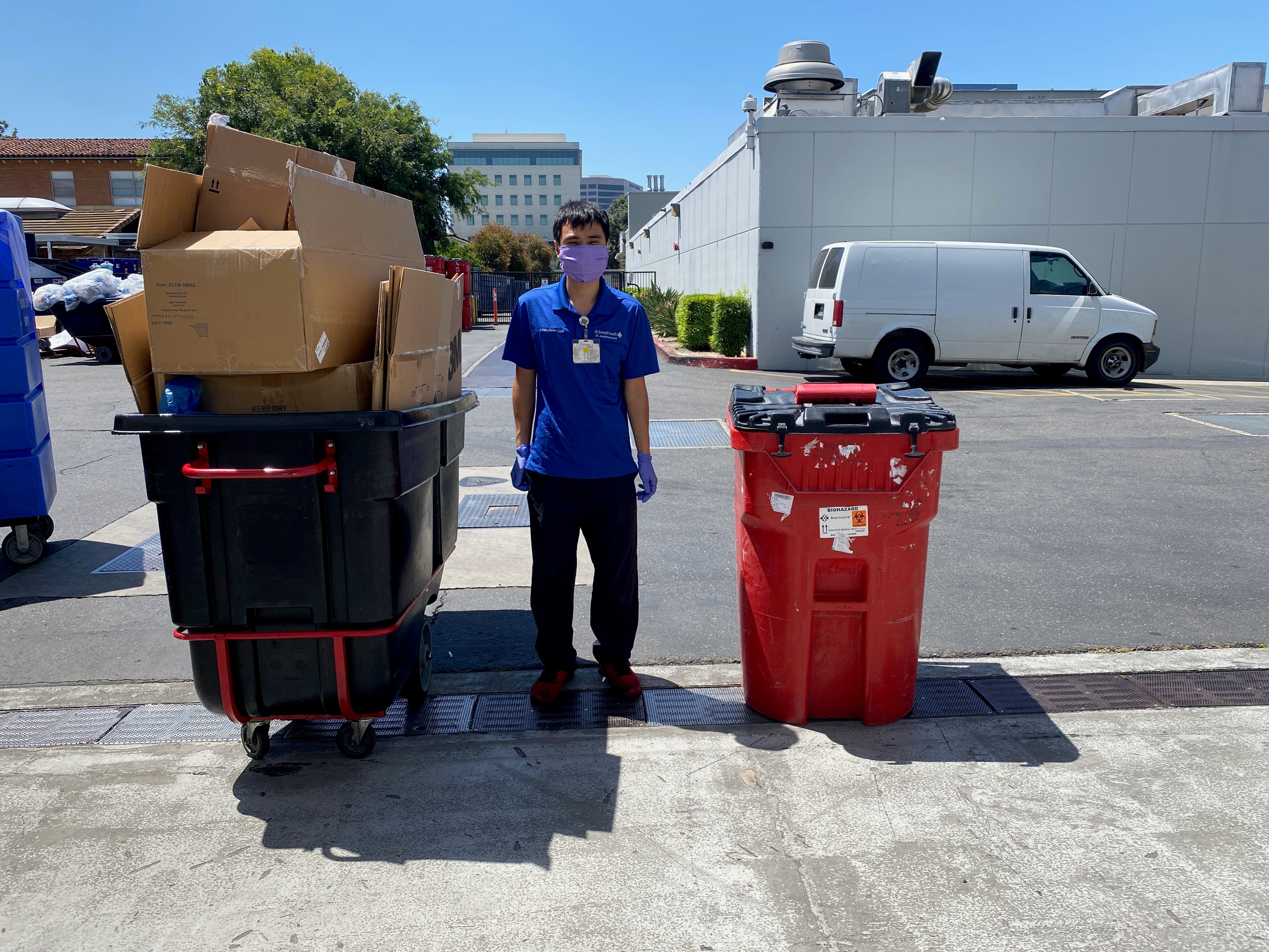 Team member Gary disposing of hospital trash