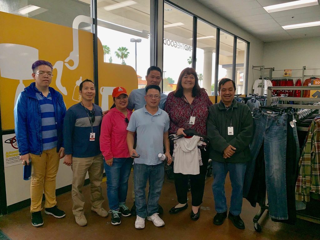 People posing at OC Goodwill store Orange County